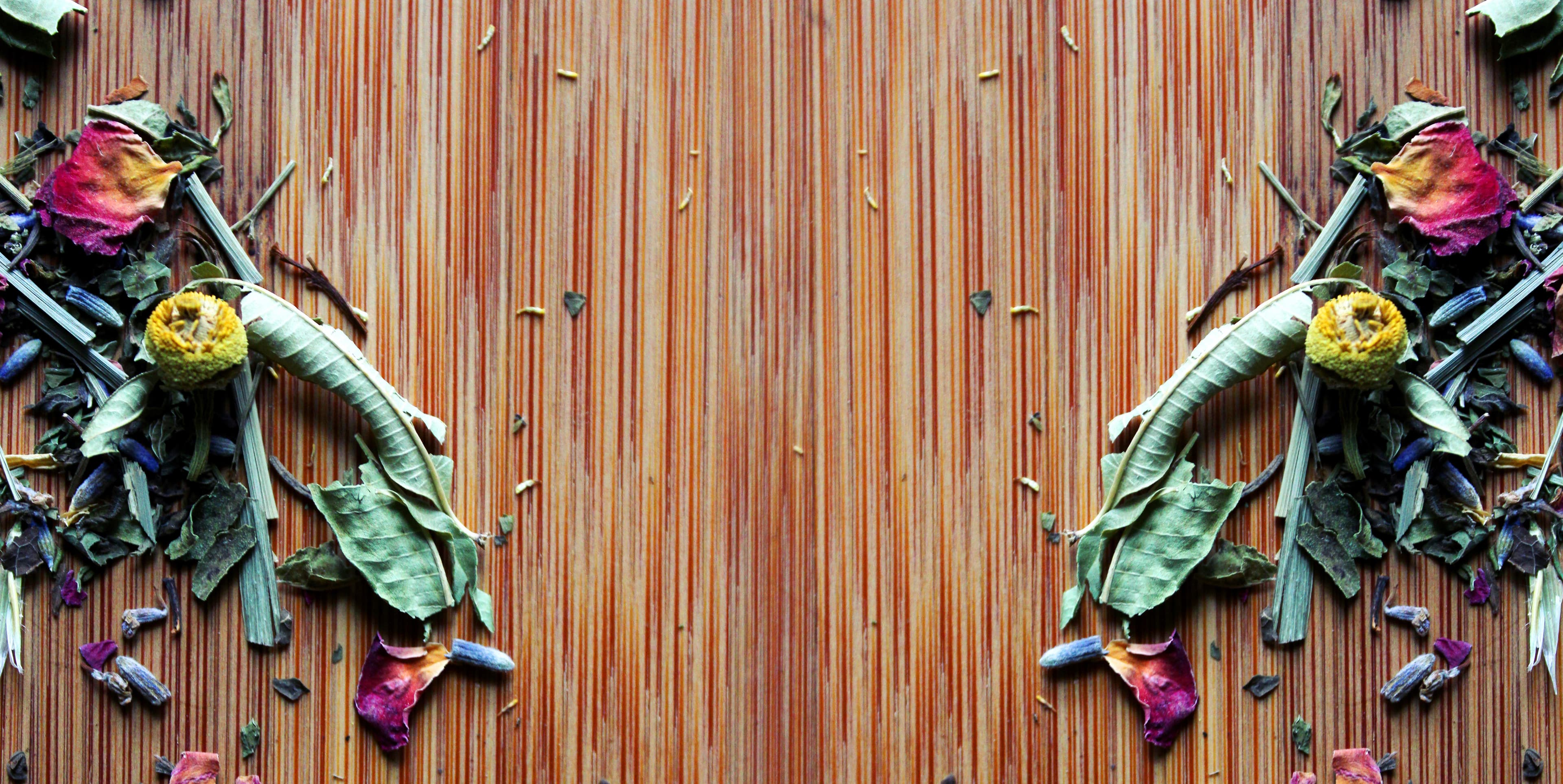 Decorative cover image for desktop webpage. Image is of a wooden cutting board with colorful dried herbs mirrored on left and right sides